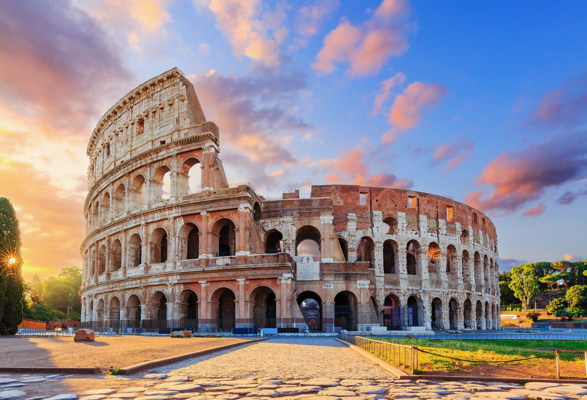 Rome, Italy. The Colosseum or Coliseum at sunrise.